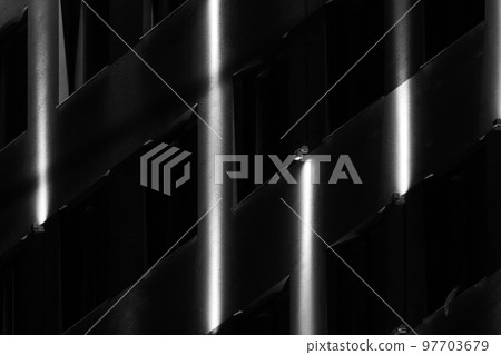 Dark facade with illumination pattern at night Dark facade with illumination pattern at night 97703679