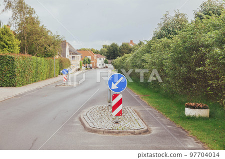 Concrete islands on street in Denmark that force drivers to slow down Concrete islands on street in Denmark that force drivers to slow down 97704014