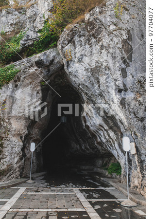 Karst cave entrance Postojnska-Jama in Slovenia Karst cave entrance Postojnska-Jama in Slovenia 97704077