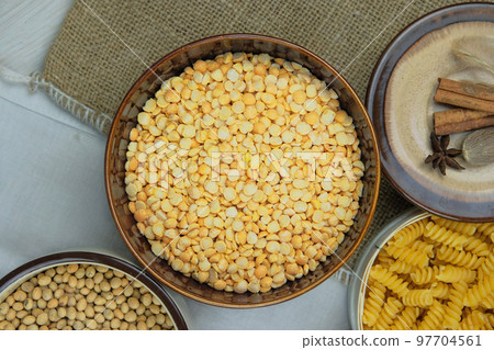 Pea in bowl on a straw background. Vegetarian organic product. Vintage view. Top view. Pea in bowl on a straw background. Vegetarian organic product. Vintage view. Top view. 97704561