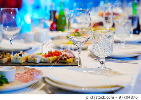 empty wine glasses on the table. tableware for the banquet. empty wine glasses on the table. tableware for the banquet. 97704870