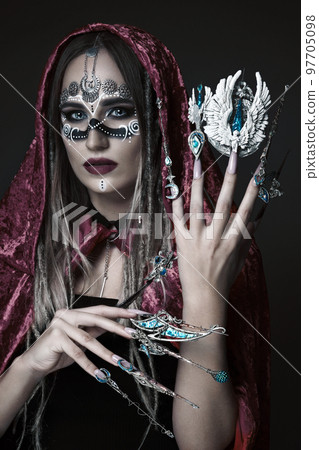 Beautiful woman with art makeup, creative long nails. Design manicure. Beauty face. 97705098