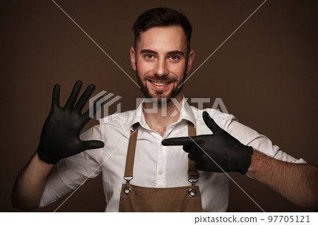 Manicur master man in working form in black gloves on hands. Nail photo content Manicur master man in working form in black gloves on hands. Nail photo content 97705121