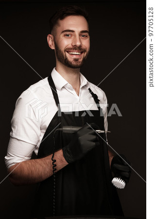 Manicur master man in working form with tools in hand. Nail photo content Manicur master man in working form with tools in hand. Nail photo content 97705128