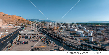 Aerial view of Salt Lake city oil refineries. Burning coal producing energy. Air pollution environmental contamination, ecological disaster earth planet problems concept. Aerial view of Salt Lake city oil refineries. Burning coal producing energy. Air pollution environmental contamination, ecological disaster earth planet problems concept. 97707399