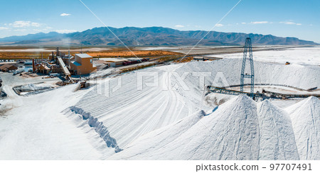 Salt Lake City, Utah landscape with desert salt mining factory at lake Bonneville with piles of white mineral and industrial equipment Salt Lake City, Utah landscape with desert salt mining factory at lake Bonneville with piles of white mineral and industrial equipment 97707491