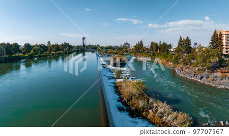 Aerial panoramic view of the waterfall in city of Idaho Falls, ID, USA. 97707567