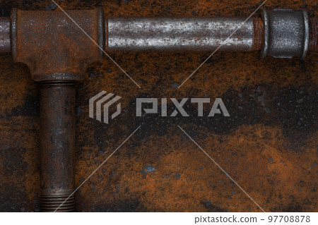 Old rusty valve pipes on rusty metal wall background Old rusty valve pipes on rusty metal wall background 97708878