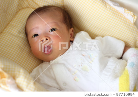 2 months old baby talking to mom 97710994