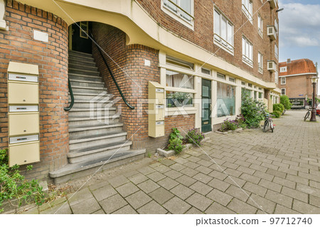 View of street near building with beauty of vagitaion outside 97712740