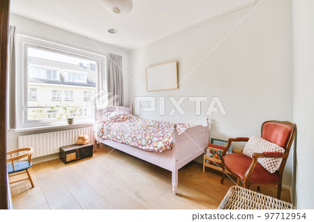 Home interior design of bedroom with bed and wooden wardrobe placed in corner near window in modern apartment Home interior design of bedroom with bed and wooden wardrobe placed in corner near window in modern apartment 97712954