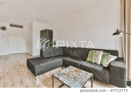 Counters with stove and oven located in modern kitchen near dining room at home 97713775