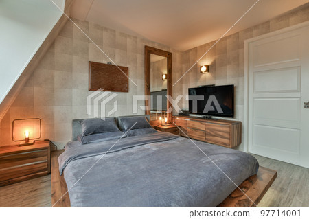Home interior design of bedroom with bed and wooden wardrobe placed in corner near window in modern apartment Home interior design of bedroom with bed and wooden wardrobe placed in corner near window in modern apartment 97714001