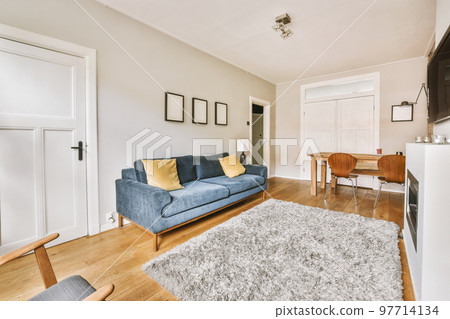 Interior design of modern minimalist style living room with large windows and wooden couch and cabinet and TV placed on white wall 97714134