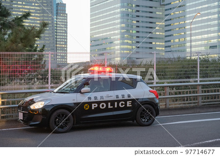A police car being dispatched in the Yokohama Minatomirai district 97714677