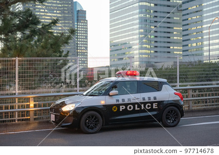 A police car being dispatched in the Yokohama Minatomirai district A police car being dispatched in the Yokohama Minatomirai district 97714678