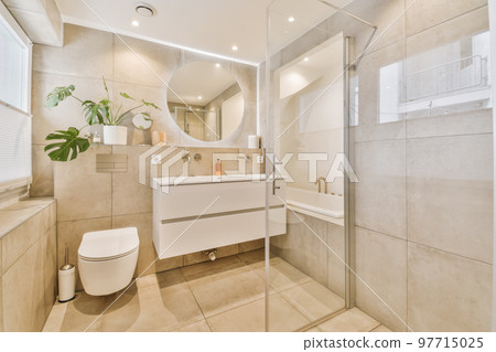 a bathroom with a toilet, sink, and bathtub in the middle of the photo is white tiles on the floor 97715025