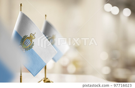 Small flags of the San Marino on an abstract blurry background Small flags of the San Marino on an abstract blurry background 97716023