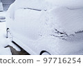 A photo of a snow country landscape with snow piled up on a car A photo of a snow country landscape with snow piled up on a car 97716254