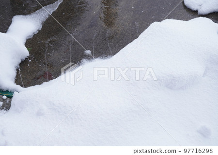 A picture of melting the accumulated snow with a snow melting device A picture of melting the accumulated snow with a snow melting device 97716298