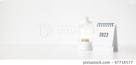 New year 2023 business calendar and lamp on office table in new year day. Make a work plan for the start of the year. Concept about Celebration, Business, Christmas, New Year. 97716577