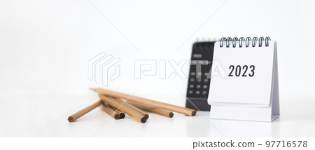 New year 2023 business calendar and pencil on office table in new year day. Make a work plan for the start of the year. Concept about Celebration, Business, Christmas, New Year. 97716578