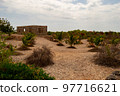 stone house under construction on a promontor 97716621