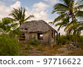 Eco-friendly tribal hut with thatched roof, 97716622
