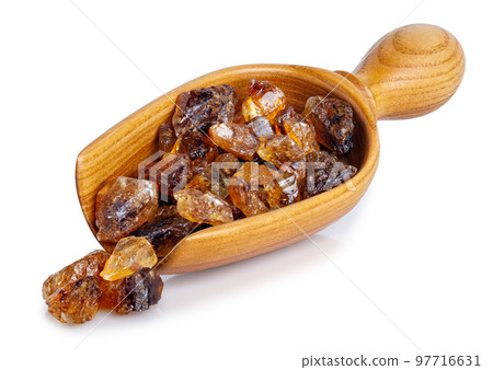 brown caramelized sugar in wooden scoop isolated on white 97716631