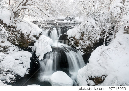 Date City, Hokkaido, Sankai Falls covered in deep snow in winter [December] 97717953