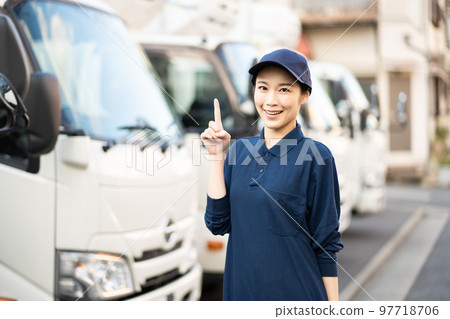 Young female worker in the delivery industry (pointing pose) 97718706