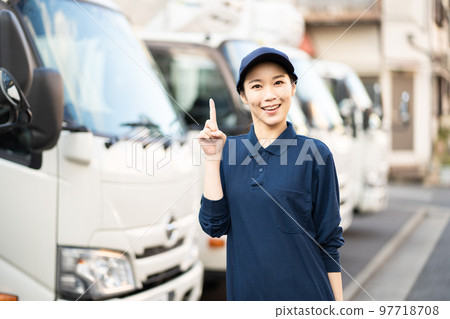 Young female worker in the delivery industry (pointing pose) 97718708
