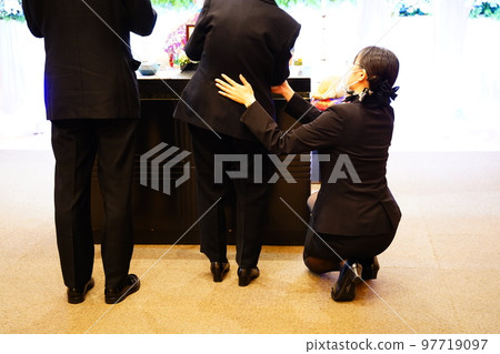 Ceremony lady helping the elderly 97719097