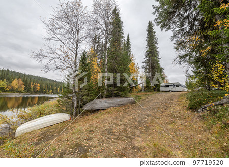 camping caravan near river autumn fall landscape along Ammarnas National Park in Lapland Sweden 97719520