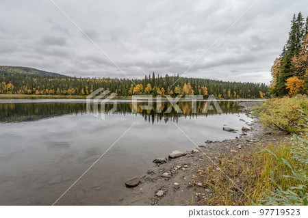 camping caravan near river autumn fall landscape along Ammarnas National Park in Lapland Sweden 97719523