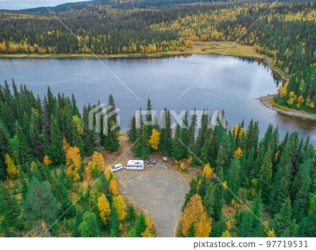 aerial view camping caravan near river autumn fall landscape along Ammarnas National Park in Lapland Sweden 97719531