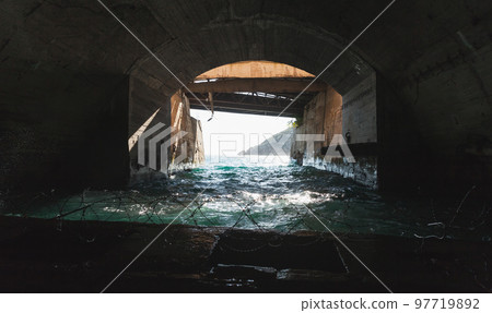 Exit gate of a concrete undergrounf tunnel, Balaklava, Crimea 97719892