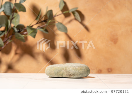 Natural empty background for cosmetic product presenation, packaging mockup made with stone and eucalyptus. Minimal nature scene. Front view, copy space. Natural empty background for cosmetic product presenation, packaging mockup made with stone and eucalyptus. Minimal nature scene. Front view, copy space. 97720121