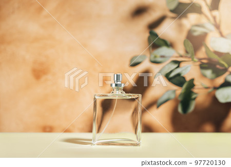 Transparent perfume bottle on a mediterranean style background. Front view. 97720130