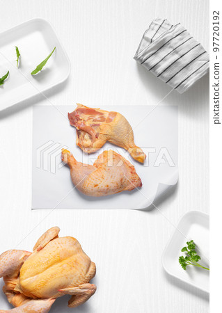Chicken thighs on a kitchen with some herbs Chicken thighs on a kitchen with some herbs 97720192