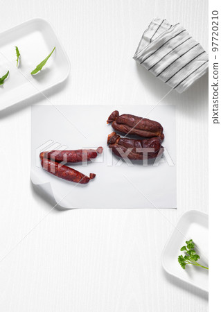 Typical spanish chorizos on a kitchen with some herbs Typical spanish chorizos on a kitchen with some herbs 97720210