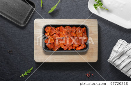 Spanish Zorza on a flat lay of a kitchen with various items 97720218