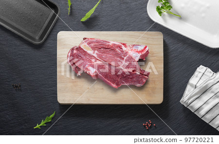 Beef garter on a flat lay of a kitchen with various items Beef garter on a flat lay of a kitchen with various items 97720221