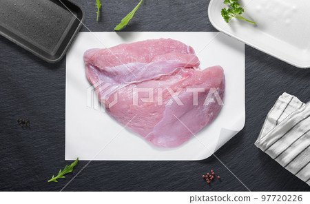 Turkey breast on a flat lay of a kitchen with various items Turkey breast on a flat lay of a kitchen with various items 97720226