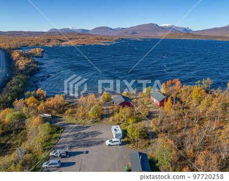 aerial Car Camping Caravan parking lake Abisko national park Bjoerkliden swedish lapland fall colors ruska indian summer 97720258