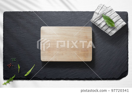 Empty cutting board with various food items Empty cutting board with various food items 97720341