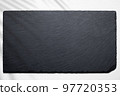 Slate plate against white wood flat lay 97720353