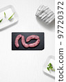 Criollo chorizo on a kitchen with some herbs 97720372
