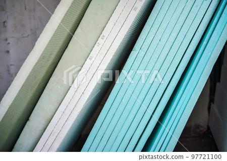 Foam polystyrene insulation boards ready for installation at new house construction, closeup detail 97721100