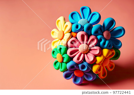 Small plasticine flower with rounded petals on delicate pink background Small plasticine flower with rounded petals on delicate pink background 97722441